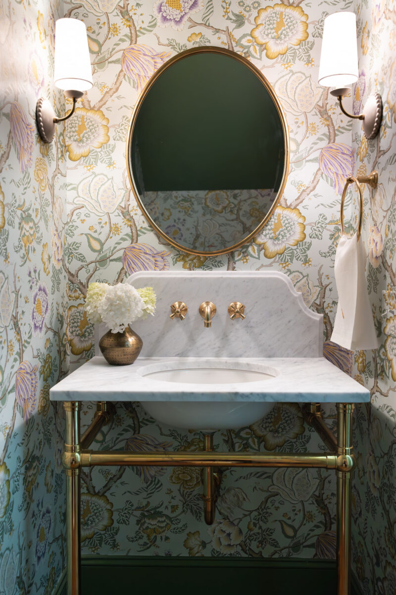 Wall mounted brass sink with marble countertop and custom scalloped backsplash | Twin Construction 