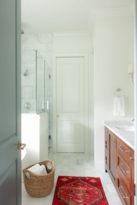 Warm Classic Primary Suite Bathroom Entry | Twin Construction