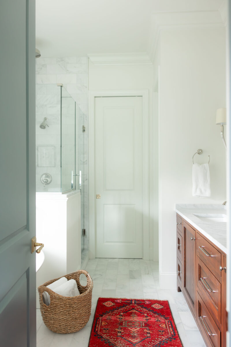 Warm Classic Primary Suite Bathroom Entry | Twin Construction 