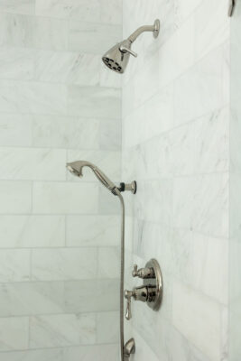 Marble Shower Tile and Polished Nickel | Twin Construction