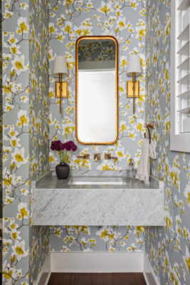 Powder Room with floral wallpaper with pops of yellow | Twin Construction