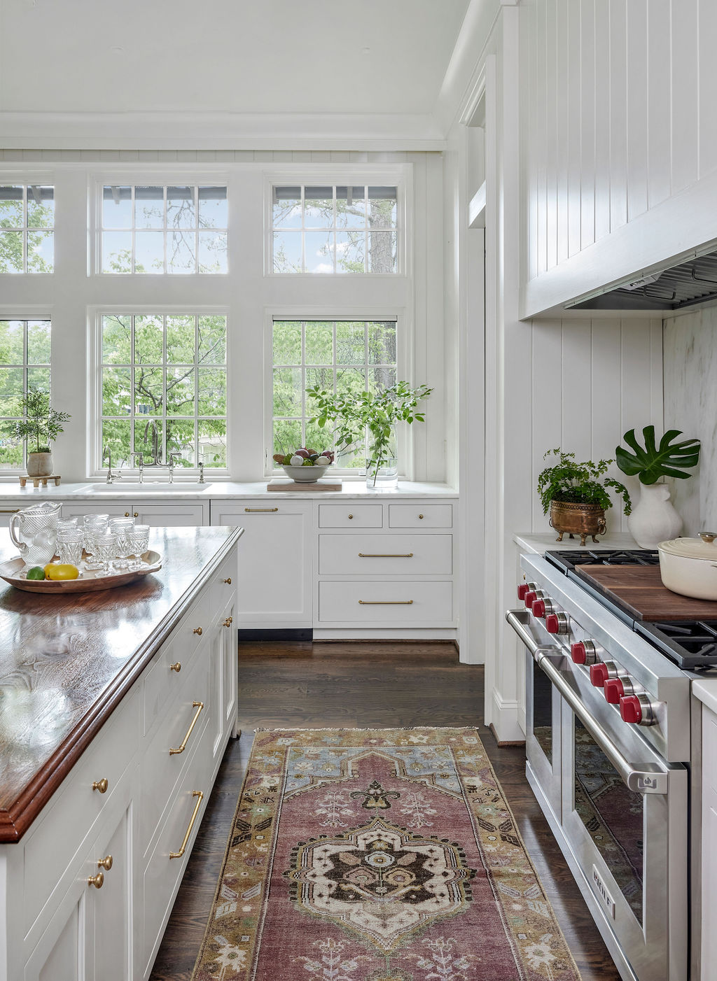 White kitchen with marble countertops and walnut wood countertops | Twin Construction