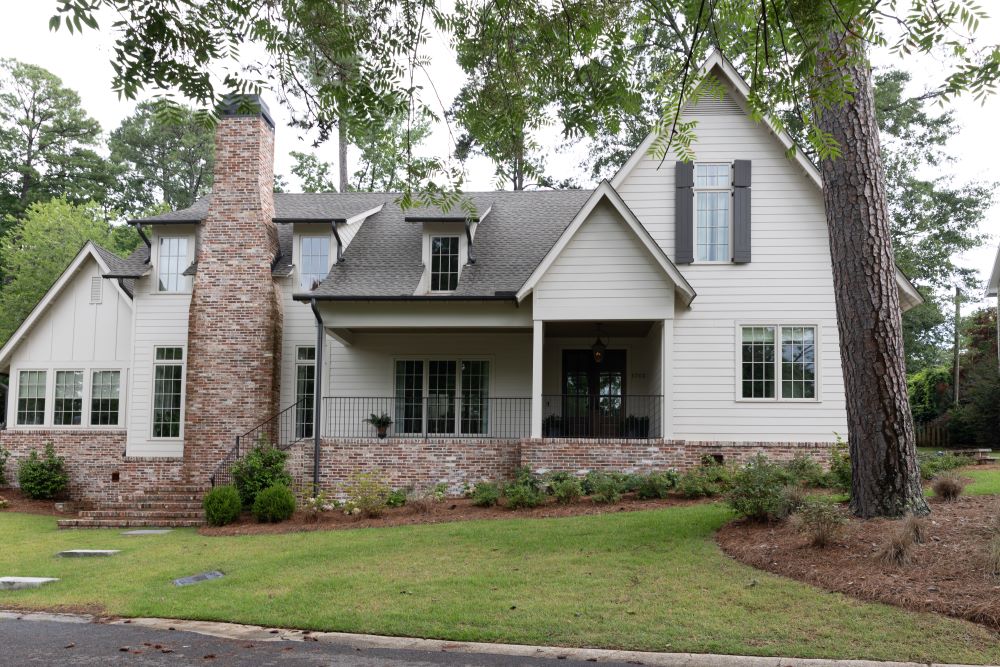 White siding and brick new construction exterior | Twin Construction